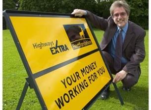 County Councillor Stuart Pile with the new Highways Extra signage